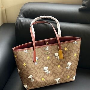 Coach X Peanuts City Tote In Signature Canvas With Snoopy Woodstock Print